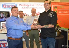 Chef Travis Peters of The Parish in Tucson, AZ (representing Shamrock Foods, a Markon Cooperative member) won Cal Giant's 2nd annual Chef Invitational and receives the award from Tom Smith with California Giant.